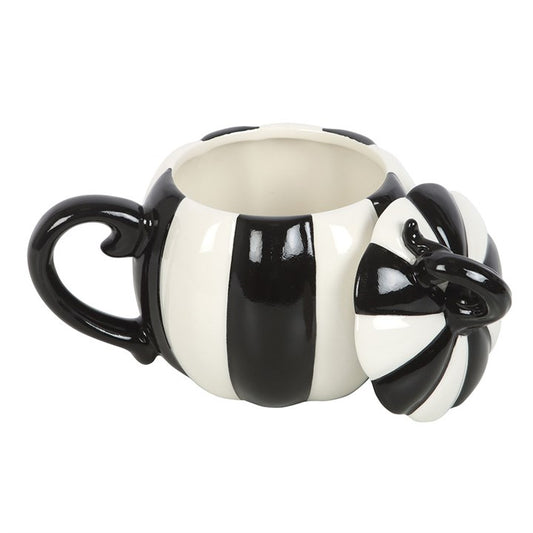 “A potion safe beneath its enchanted lid.”
Sip your favorite brews in style with this striking Black and White Striped Pumpkin Lidded Mug. Its bold, alternating stripes and pumpkin shape make it a captivating piece for any witchy or gothic kitchen. Handwash only and not suitable for microwaves, it is designed for careful use during ritual teas, cozy evenings, or gatherings where a hint of the unusual is welcome.

In folklore, pumpkins are symbols of protection and abundance, and lids serve as a magical barr