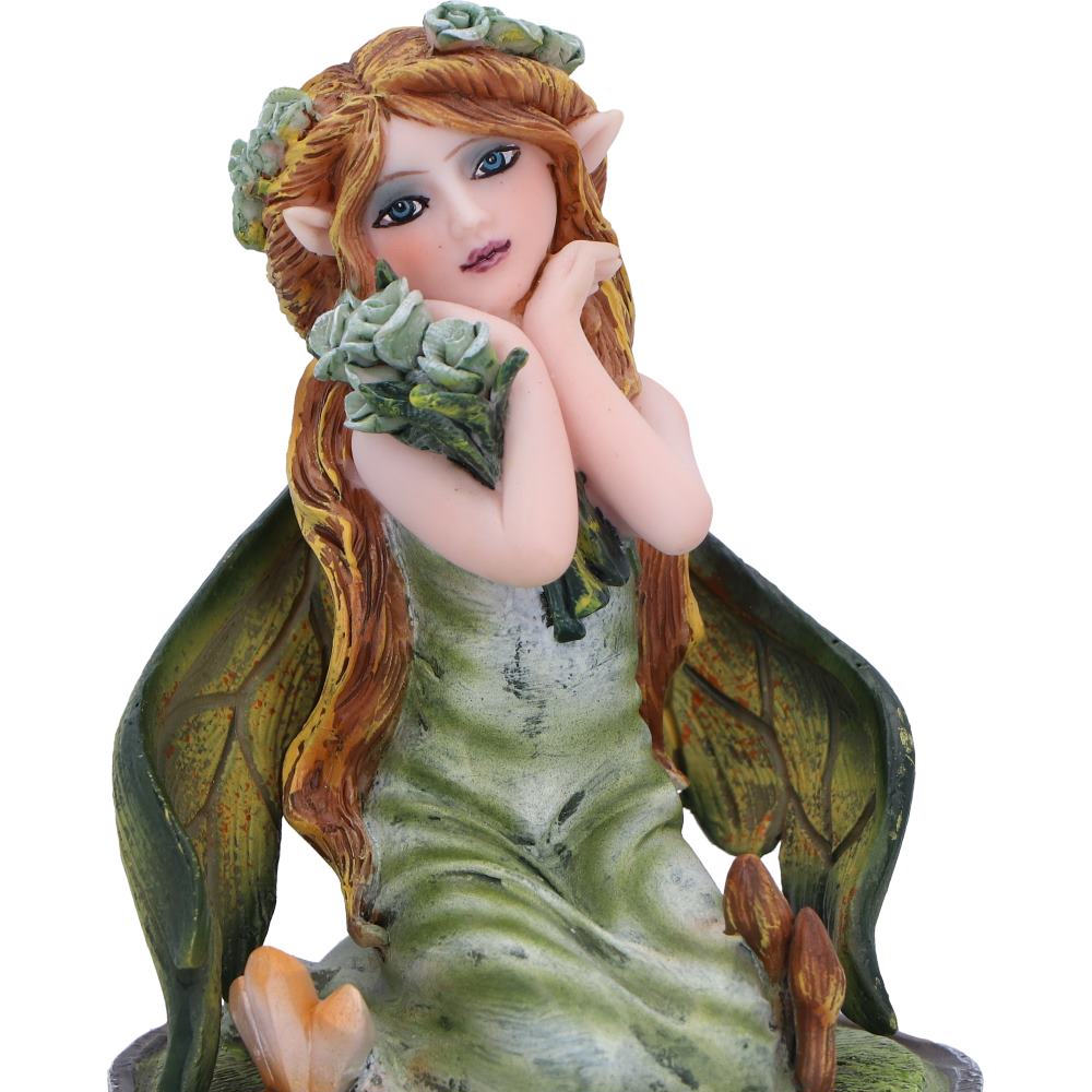 Elf figurine with long hair and pointed ears holding a leafy branch on a white background