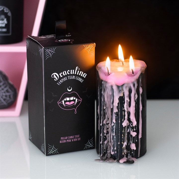 Add a pop of gothic glamour to your home with this large pink unscented pillar candle, which bleeds pink wax when lit for dramatic effect. A perfect décor piece for creating a moody vibe or as a unique gift.
