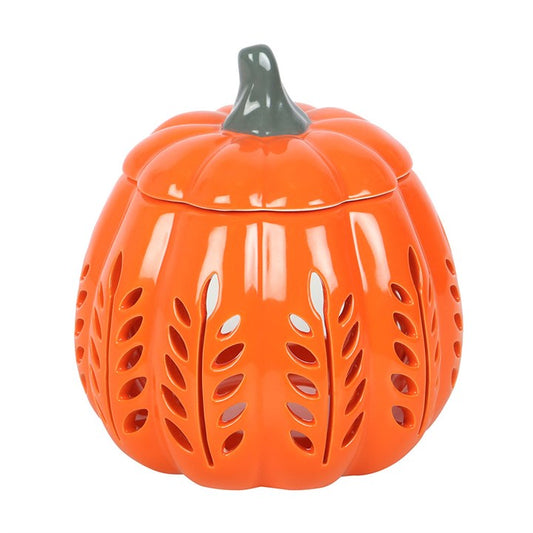 Orange pumpkin-shaped ceramic jar with a lid on a white background