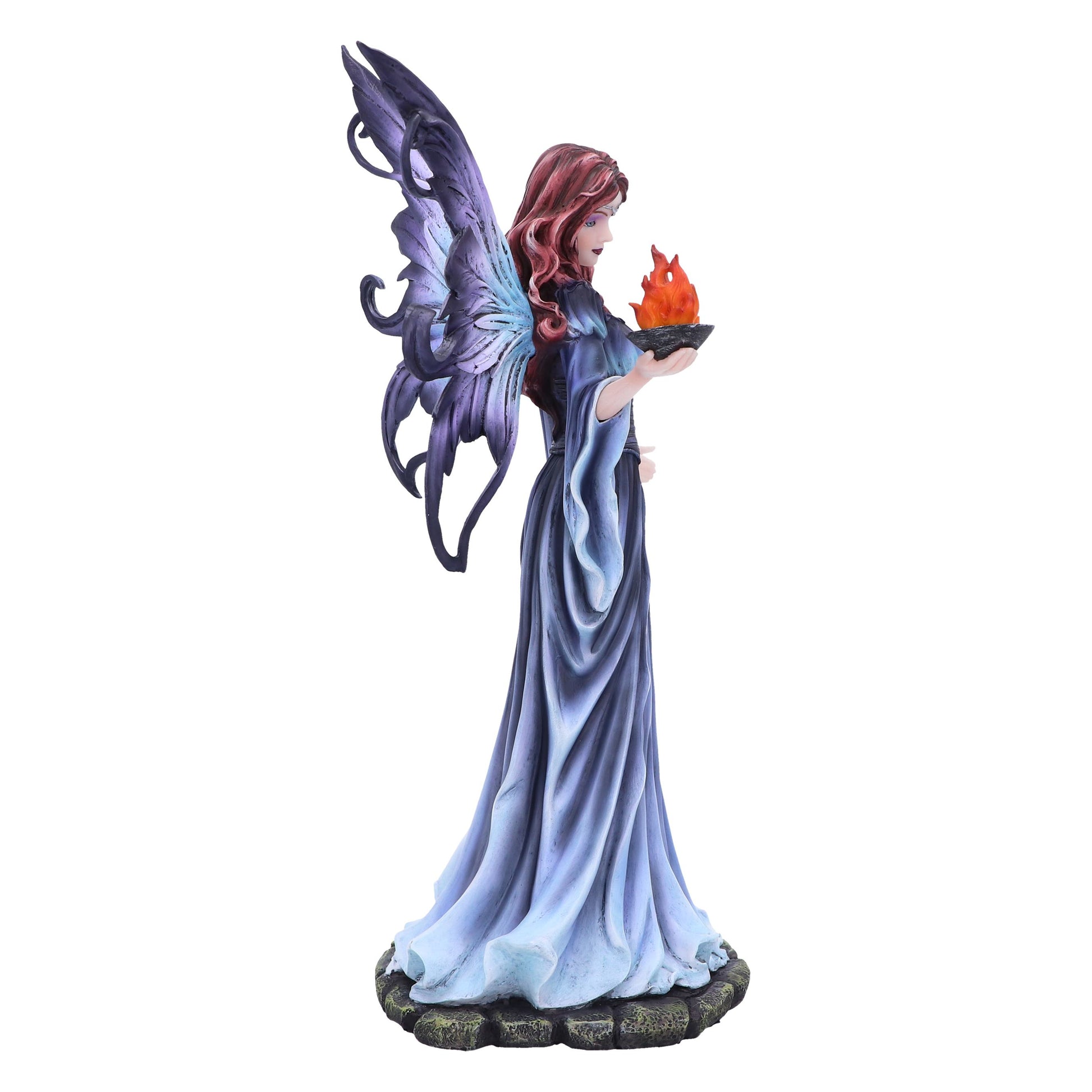 Statue of a fairy with purple wings and a blue dress holding a flame on a white background