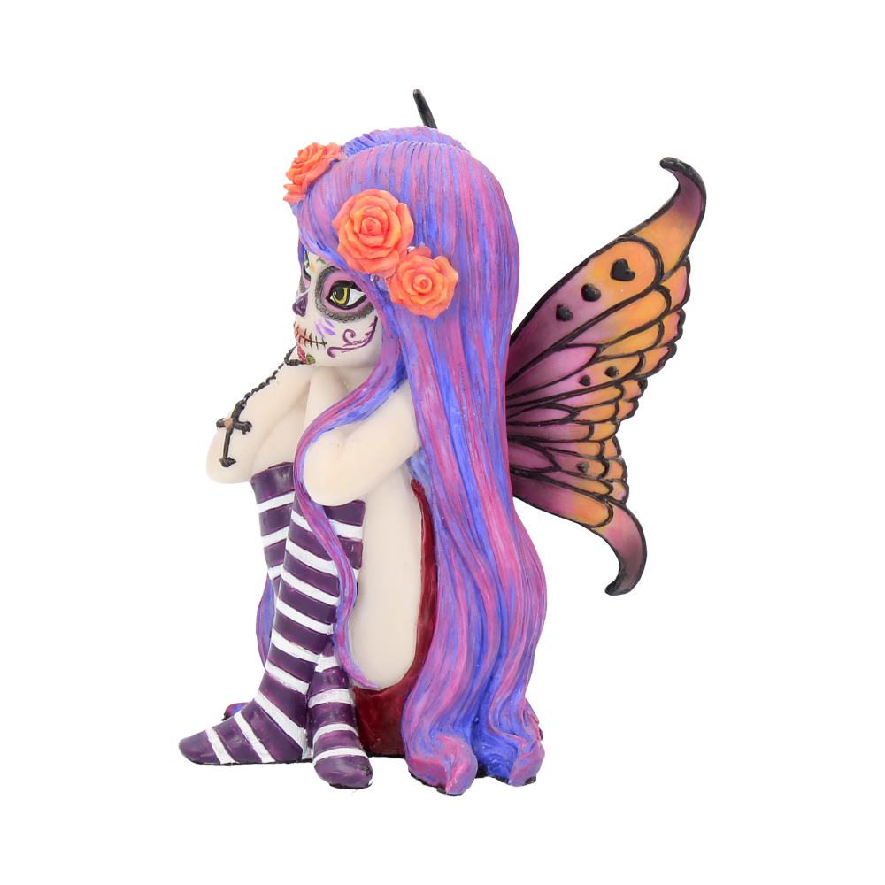 Colorful fairy figurine with butterfly wings on a white background