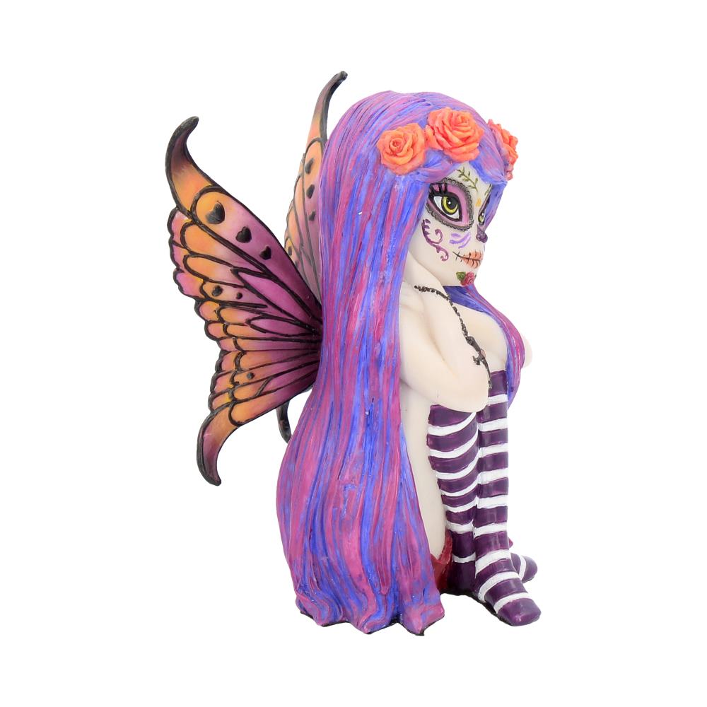 Colorful fairy figurine with butterfly wings on a white background