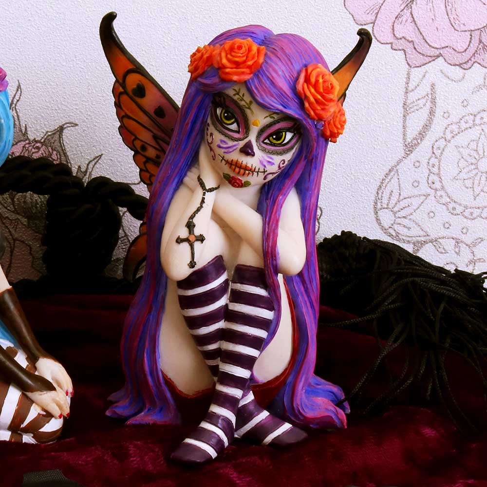 Colorful figurine with purple hair and striped stockings against a decorative background