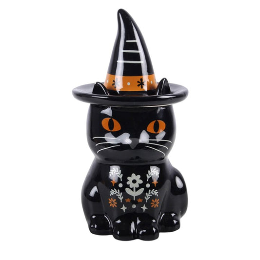 Add a rustic seasonal touch to the home with this black cat ceramic oil burner, featuring a folk-inspired design with simple floral details. Topped with a matching lid, this piece is perfect for autumn displays or as a gift for those who enjoy characterful home fragrance accessories. Designed for use with diluted fragrance oil, simply place a standard tealight inside and remove the lid whilst in use.