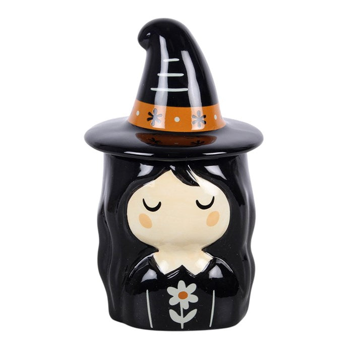 Add a rustic seasonal touch to the home with this witch ceramic oil burner, featuring a folk-inspired design with simple floral details and a classic pointed hat. Finished with a matching lid, this piece is ideal for autumn displays or as a thoughtful gift for those who enjoy characterful home fragrance accessories. Designed for use with diluted fragrance oil, simply place a standard tealight inside and remove the lid whilst in use.