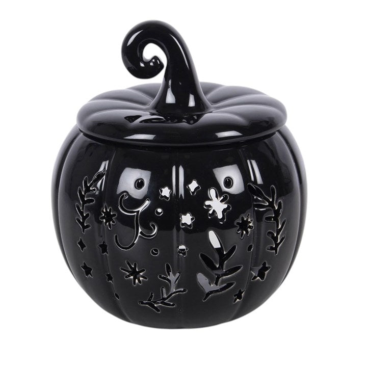 Create a stylish seasonal display with this pumpkin-shaped oil burner and wax warmer in inky black. With intricate folk-inspired cut-outs for a gentle glowing effect, it's perfect for classic autumn or Halloween decorating. Simply place a single standard tealight in the space at the back and add a few drops of diluted fragrance oil or wax melts in the bowl. Always remove the lid whilst in use.