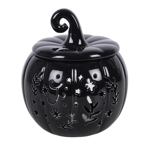 Create a stylish seasonal display with this pumpkin-shaped oil burner and wax warmer in inky black. With intricate folk-inspired cut-outs for a gentle glowing effect, it's perfect for classic autumn or Halloween decorating. Simply place a single standard tealight in the space at the back and add a few drops of diluted fragrance oil or wax melts in the bowl. Always remove the lid whilst in use.