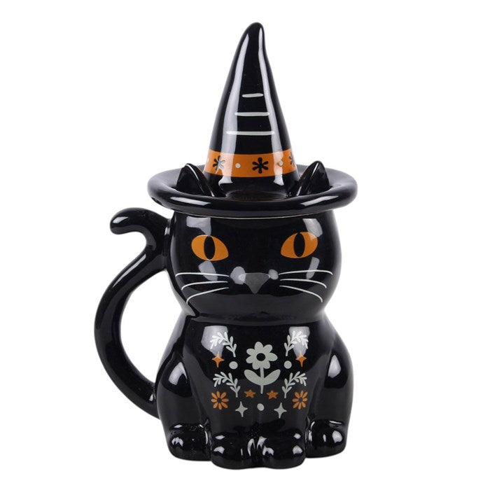 Enjoy a cosy drink in seasonal style with this black cat lidded mug, featuring a folk-inspired design and a witch’s hat lid for a fun and practical finish. Perfect for autumn days at home, it makes a thoughtful gift for anyone who loves themed kitchenware and characterful designs. Ideal for tea, coffee, or hot chocolate. Do not microwave. Hand wash only.