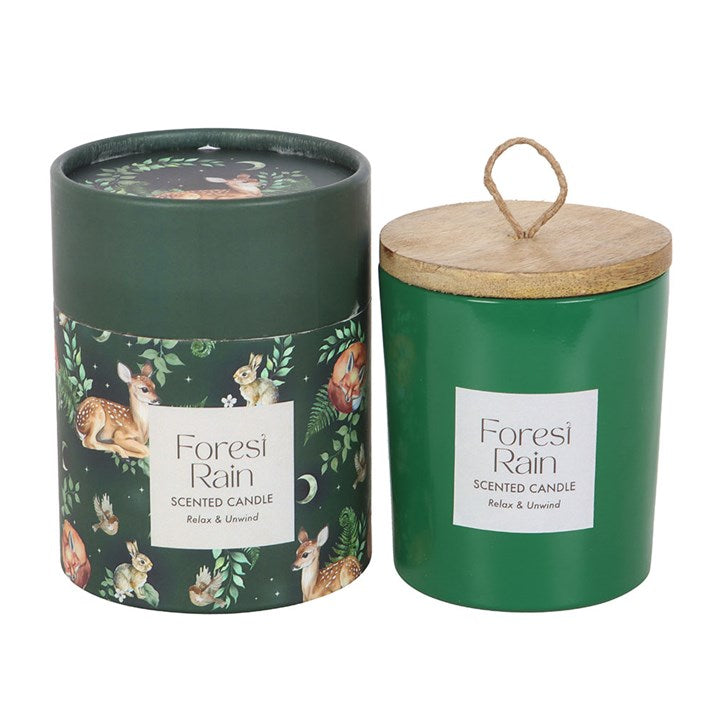 Create a soothing woodland escape at home with this fragranced candle, featuring a wooden lid and a refreshing forest rain scent. A perfect gift for cosy evenings, housewarmings, or to treat someone who loves relaxing aromas. Paraffin wax. Burn time of 28 hours.