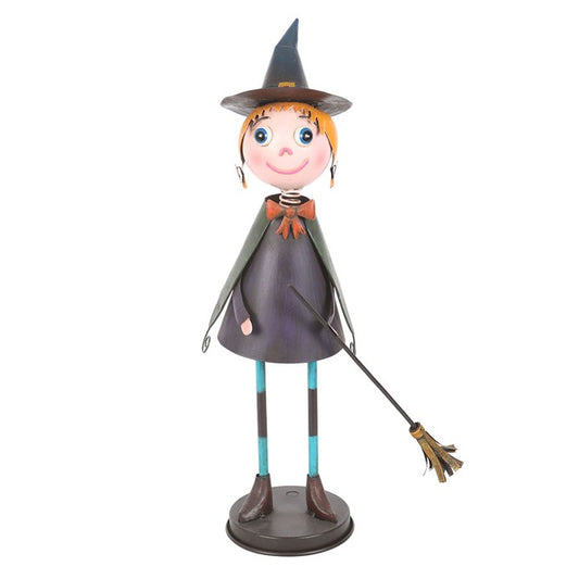 Summon a little seasonal magic with this enchanting The Witches Garden metal witch ornament. Cloaked in her flowing cape and crowned with a classic pointed hat, she takes flight with her faithful broomstick in hand. This whimsical piece brings a playful yet spooky charm to Halloween displays, whether perched upon a mantel, brightening up shelves, or welcoming guests from a seasonal porch display. Suitable for outdoor use, though best kept sheltered from harsh weather to preserve her witchy allure. A delight