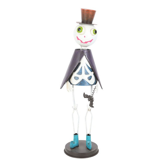 Step into the spirit world with this The Witches Garden metal skeleton ornament, dressed to impress in his stylish top hat and flowing cape. This dapper gentleman of the night brings a playful yet spooky sophistication to Halloween décor, making him a standout addition to mantels, shelves, or festive displays. Crafted from durable metal, his quirky design is perfect for lovers of ghostly gatherings and all things eerie yet fun. Suitable for outdoor use, though best kept sheltered from harsh weather to keep 