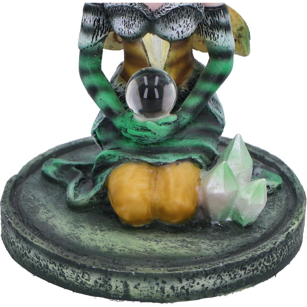 Decorative figurine crystal ball, and pumpkins on a white background
