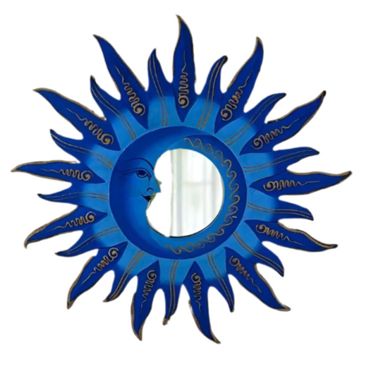 Call in balance between day and night with this Blue Moon &amp; Sun Mirror, a handcrafted treasure painted in vibrant celestial tones. The sun radiates warmth, the moon offers calm, and together they weave harmony into your home.

Lovingly made by fairtrade artisans in Indonesia, each 40cm x 40cm mirror is unique, carrying the energy of both art and ritual. More than a mirror, it is a tool of reflection and intention — perfect for meditation spaces, bedrooms, or as a sacred gift for one who walks the path o