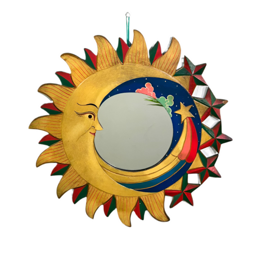 Call upon the mysteries of the cosmos with this handcrafted Sky Mirror, adorned with sacred carvings of the sun, moon, and stars. Each piece is a portal of reflection and intention, lovingly shaped by skilled artisans in Indonesia through fairtrade practice. The detailed celestial symbols bring light, protection, and balance into your home, radiating an energy that aligns your space with the rhythms of the universe.

Measuring 50cm, this wooden mirror is both a striking piece of décor and a spiritual tool f