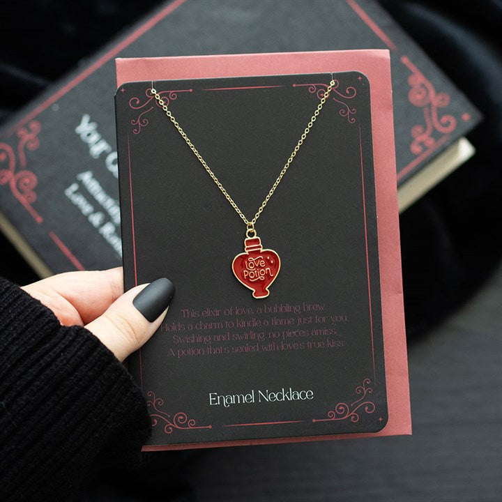 While some wear their hearts on their sleeves, you can wear yours around your neck. This necklace features an enamel love potion charm that is sure to catch someone's eye.