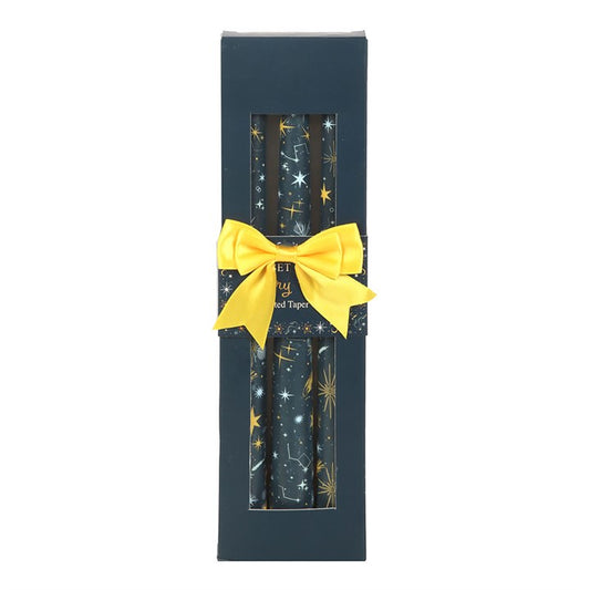 Step into the mystical glow of the cosmos with our Set of 3 Starry Night Taper Candles. Each candle is hand-crafted with care, featuring a mesmerizing starry night design that captures the wonder of the heavens. Perfect for enchanting Christmas tables, moonlit rituals, or year-round celestial décor, these unscented candles offer a magical ambience wherever they burn.

In folklore, stars have long been symbols of guidance, protection, and cosmic energy. Lighting these candles can invite clarity, inspiration,