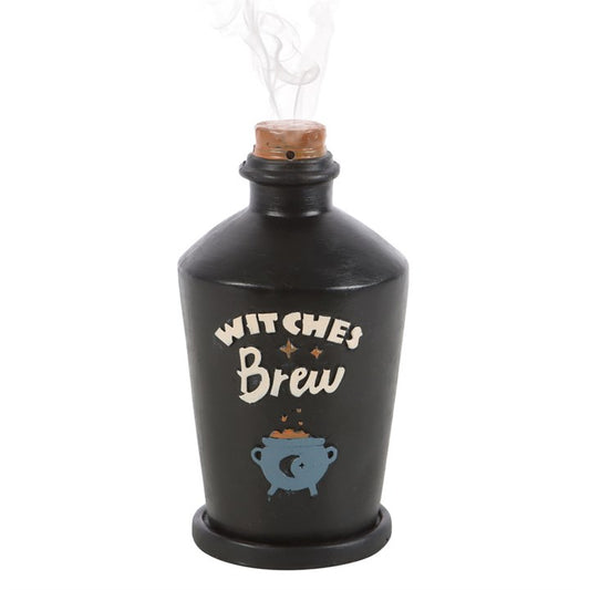 Black bottle labeled 'Witches' Brew' with a cork on a white background