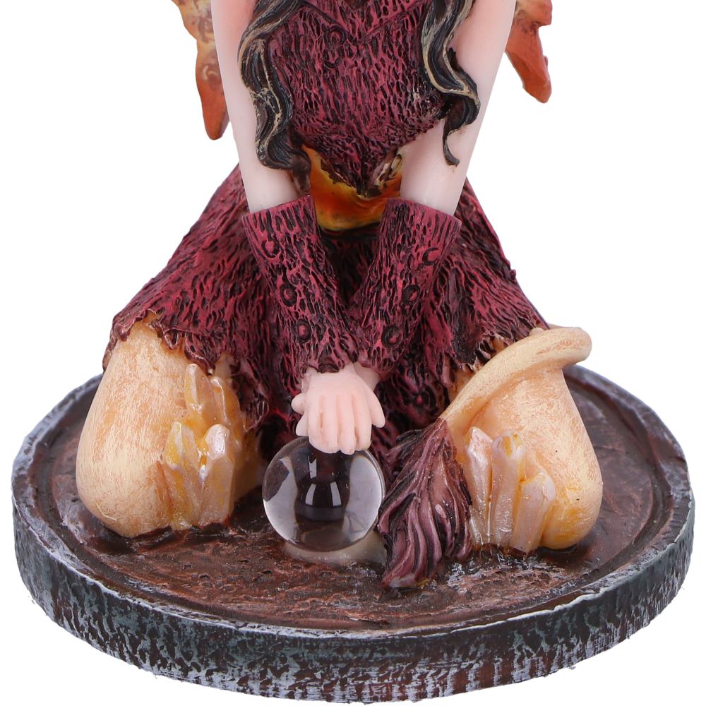 Figurine with a glass orb on a round base
