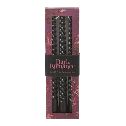 Call forth elegance from the shadows with this trio of twisted black taper candles, crafted for those who favour darkness over daylight. Their spiralling silhouettes catch the glow of flame like winding serpents, making them perfect for gothic interiors, ritual tables, or decadent gatherings held under dim, deliberate light.

Unscented yet undeniably commanding, each taper burns for approximately five hours—long enough to illuminate spellwork, brooding feasts, or soirées where secrets are shared in hushed t
