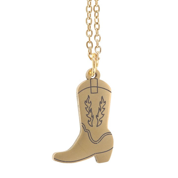 Gold cowboy boot pendant on a chain against a white background