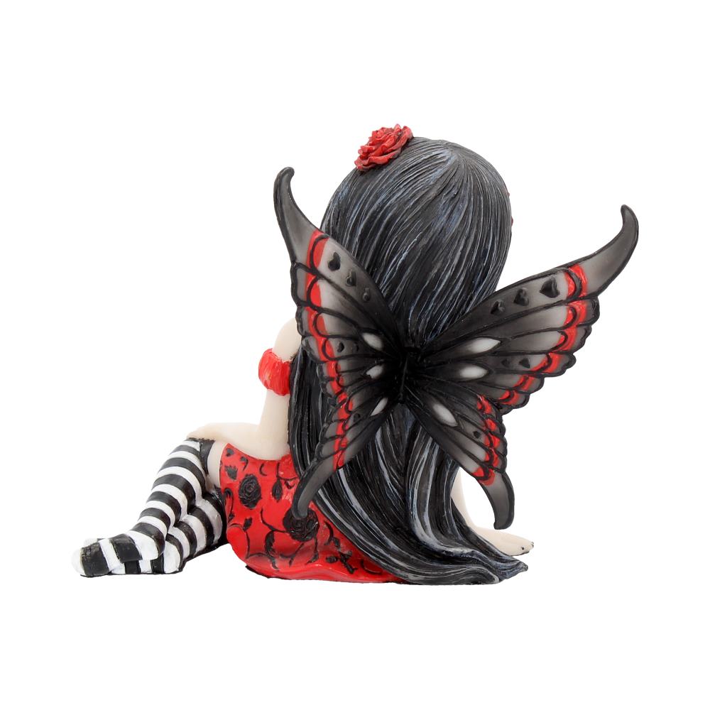 Gothic-style figurine with butterfly wings on a white background