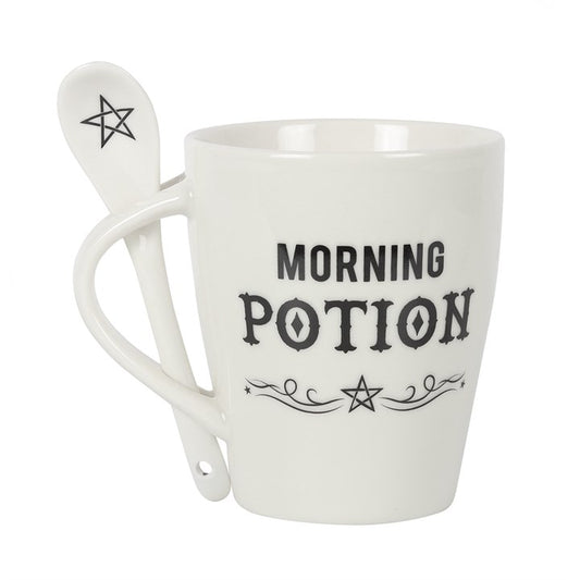 “Every brew is a potion, every sip a spell.”
This enchanting white ceramic mug and spoon set is inscribed with the phrase “Morning Potion” — the perfect companion for your daily ritual. With dimensions H10cm x W11.5cm x D8.5cm, this 320ml vessel is both microwave and dishwasher safe, making it as practical as it is magical. The matching spoon fits neatly into the handle, ready for stirring honey, herbs, or sugar into your brew.

In witchcraft, the act of stirring is more than motion — it is intention. Clock