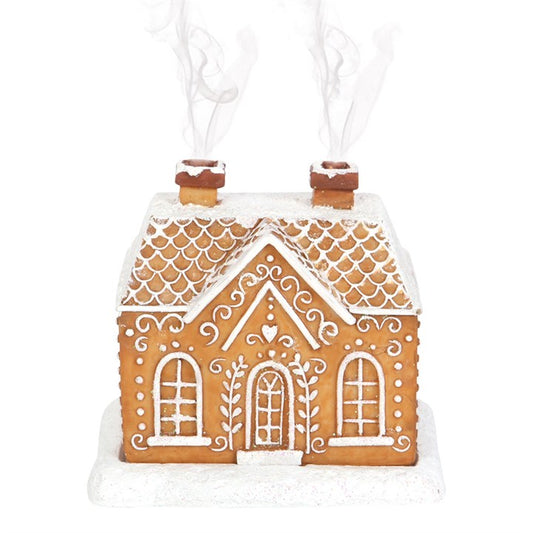 This enchanting incense cone burner takes the form of a gingerbread house dusted with shimmering snow and glitter. Light an incense cone beneath it and witness magical wisps of smoke drift from its twin chimneys. A charming and mystical addition to your Yuletide rituals.