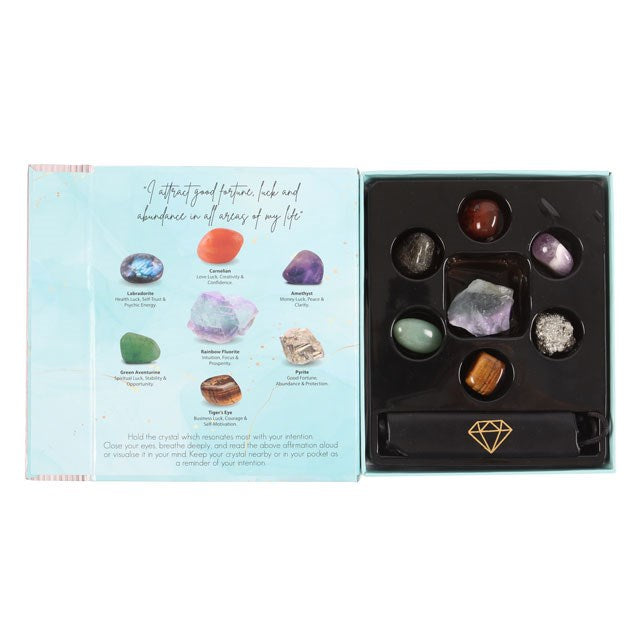 Manifestation crystal gift set with 7 natural stones and faux leather pouch. Perfect for attracting abundance, meditation, and spiritual rituals.