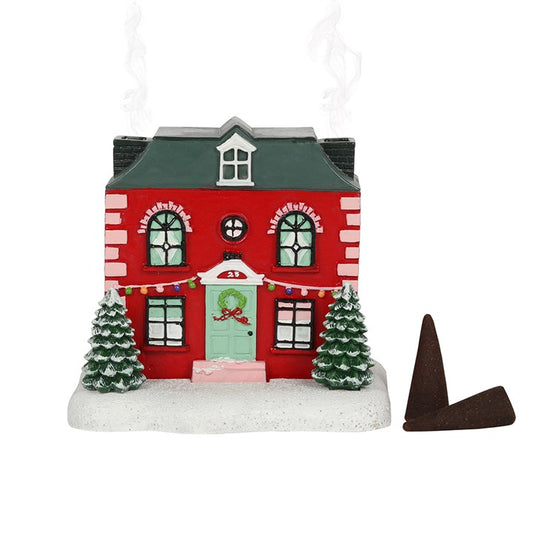 This charming Christmas house incense cone burner brings festive magic to your space. Light an incense cone inside and see mystical smoke drift from its twin chimneys, creating an enchanting holiday atmosphere. Dimensions: H8.5cm x W9.5cm x D8.5cm. Packaged size: H13cm x W13cm x D12cm.