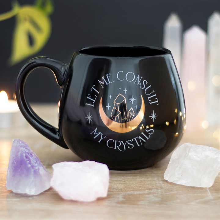 Black ceramic mug with “Let Me Consult My Crystals” text and gold foil design. Perfect gift for witches, crystal lovers, and mystical home décor.