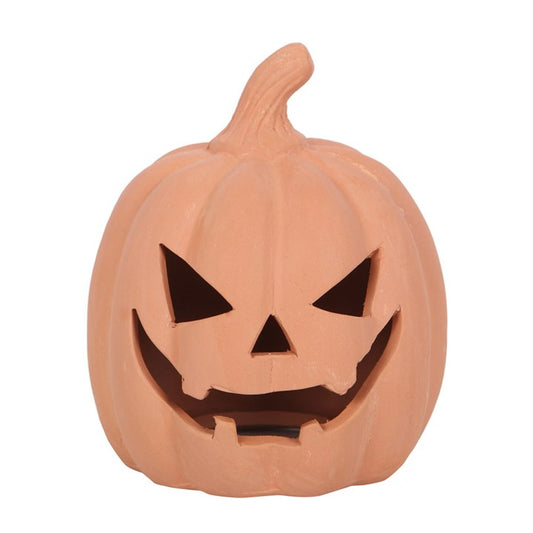 By fang and flame, summon a soft and spooky glow with this 12.5cm Terracotta Pumpkin Tealight Holder. Hand-shaped from earthy terracotta, this grimacing jack-o’-lantern is no mere trinket—it’s a beacon for spectral gatherings and witchy wonders.

Nestle a tealight within its hollow heart and watch the flickering flame dance through its carved features, casting eerie shadows on walls and pathways. Whether perched on your hearth, nestled among autumn leaves in the garden, or lighting the way on Samhain night,