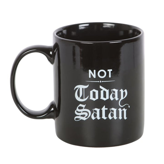 “Not Today, Satan” — a phrase as old as the witch’s circle itself.
This gothic-inspired ceramic mug is more than a vessel for your morning brew; it is a ward, a charm, and a subtle act of rebellion. Holding 300ml, microwave safe and built for daily rituals, this mug bears the protective words in bold gothic script, turning every sip into an act of banishment against intrusive energies.

In folklore and witchcraft, words carry power. Spells, chants, and inscriptions act as shields between worlds. The phrase 