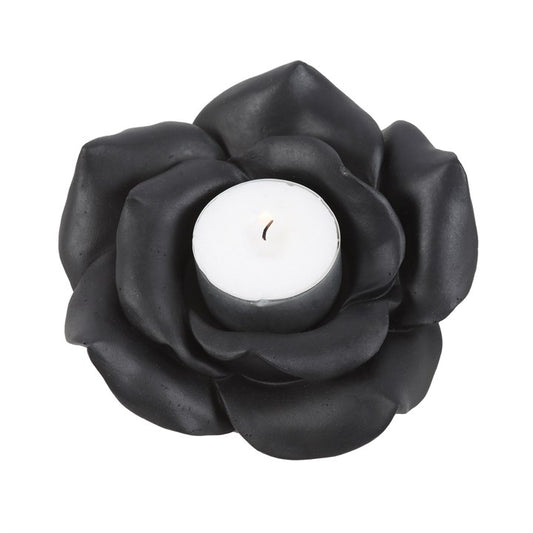 This enchanting black rose tealight holder adds a touch of timeless beauty to any space. Made of resin and intricately crafted, this tealight holder creates a romantic ambience and accommodates a standard single tealight. Never leave a burning candle unattended. Do not burn for longer than 30 minutes at a time and never allow the candle to burn all the way down to the base.
