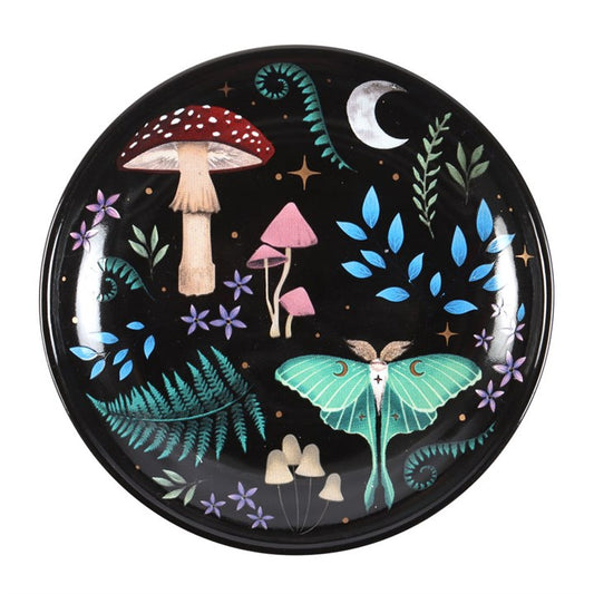 This enchanting trinket dish captures the mysterious beauty of a dark forest at night, adorned with vivid illustrations of nocturnal flora and fauna that seem to whisper ancient secrets. Golden stars shimmer across the surface, adding a celestial glow that invites magic into your space. Perfect for holding your most treasured jewellery and keepsakes, this dish transforms everyday storage into a ritual of wonder and charm. Embrace the mystical energy it brings, making it a captivating addition to any witch’s