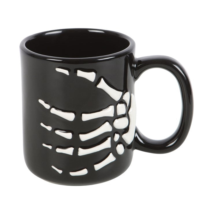 Feel dead without your morning brew? Awaken your inner ghoul with the Skeleton Hand Mug, the perfect gothic companion for those who rise from their cosy crypts only after caffeine’s dark embrace.

Crafted from durable ceramic and designed with a grasping skeletal hand, this eerie mug brings a touch of macabre humour to your daily ritual. Whether you’re sipping your morning potion or conjuring creative thoughts, its haunting design reminds you that even the undead need their coffee fix.

With a 350ml capacit