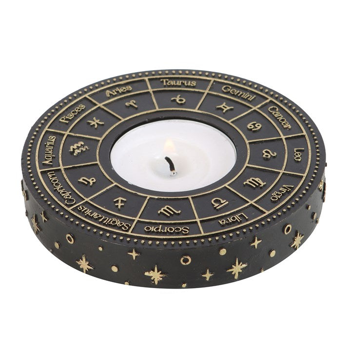 This beautiful tealight candle holder depicts the astrology wheel in intricate, gold-effect detail that looks beautiful when a lit candle is placed in the centre. A perfect finishing touch for any home with a celestial-inspired decor.