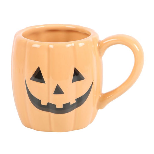 “A lantern for the soul, a smile against the dark.”
This pumpkin-shaped ceramic mug is carved with a cheerful jack-o'-lantern grin, ready to light up your Halloween brews. With a 380ml capacity, it brings the harvest season to your hands in every sip. Handwash only and not suitable for microwaves, this mug is a statement piece for any witch’s kitchen or spooky collection.
