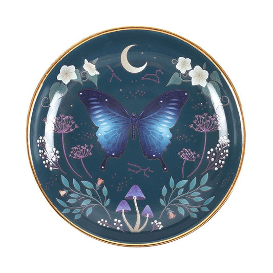 This captivating trinket dish showcases a mesmerizing midnight moth motif in deep blues, echoing the mysteries of the night sky. Adorned with intricate floral accents and shimmering gold trim, it promises to be a cherished talisman and a bewitching addition to your sacred space.