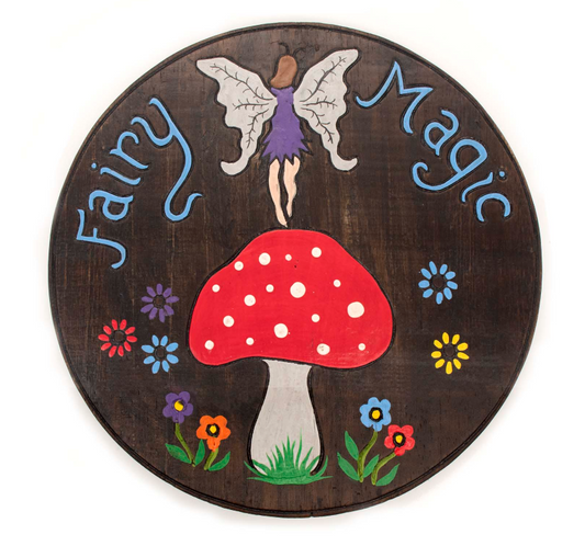 Summon woodland wonder and fae-kissed charm with this Enchanted Fairy &amp; Mushroom Plaque, lovingly handmade under distant starlit skies in Indonesia. A hand-painted fairy dances amidst magical toadstools, whispering blessings of nature, art, and spirit.

This rustic plaque is crafted for those who walk the hedge between worlds—perfect for sacred indoor nooks or enchanted garden groves. Hang it with ease using the sturdy metal loop, and let its whimsical presence awaken the old ways in your space.

Size: 