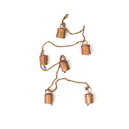 Let the wind speak and spirits stir with this enchanting String of Indian Rustic Bells. 🔔✨

Crafted by hand and hung upon a vibrant rainbow string, these six copper-toned iron bells sing a soft, melodic chime—like whispers from the veil. Each bell bears the markings of age-old techniques: surface flaws, rustic textures, and colour variations that echo their handmade magic. No two strings are the same—each holds its own spirit.

Hang them in your sacred space, garden, doorway, or altar. Use them to ward off