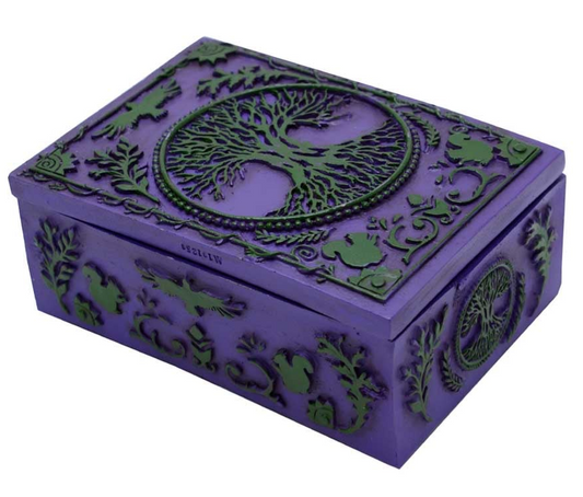 Beneath the painted boughs of the eternal Tree of Life lies a keeper of secrets. This Hand-Painted Tree of Life Wooden Box is more than storage—it is a guardian for your treasures, talismans, and spells. Each stroke of colour breathes life into its sacred design, a symbol of connection between earth, spirit, and sky.

Perfect for cradling your tarot or oracle decks, keeping silver charms safe, holding dried herbs, sacred sage, crystals, incense, stamps, or spell ingredients. Place it upon your altar, let it