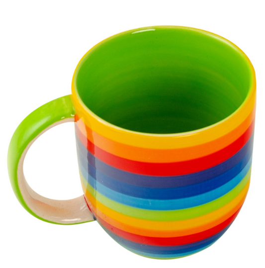Celebrate colour and comfort with this Hand Painted Rainbow Stripe Mug, crafted by skilled artisans in Thailand. Each mug carries a traditional profile that narrows slightly at the base before opening generously at the rim, finished with a high-shine glaze that brings the vibrant rainbow stripes to life. Inside, a soft pale green interior offers calm balance, creating the perfect harmony of vibrancy and serenity.

Sized at 8.5 x 8.5 x 9cm, this ceramic mug is ideal for everyday use at home, in cosy B&amp;Bs