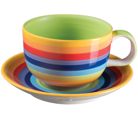 Elevate your tea or coffee ritual with the Rainbow Stripe Ceramic Large Cup &amp; Saucer, handmade in Thailand as part of Rainbow Teapot’s Rainbow Ceramics collection. Measuring 18 x 9cm, this generously sized set is perfect for enjoying a comforting cup of tea, a frothy cappuccino, or a soul-soothing herbal brew.

Each cup and saucer is hand painted with vibrant rainbow stripes, making every piece unique in character. Finished with a glossy glaze, the radiant colours shine brightly, uplifting both the spir