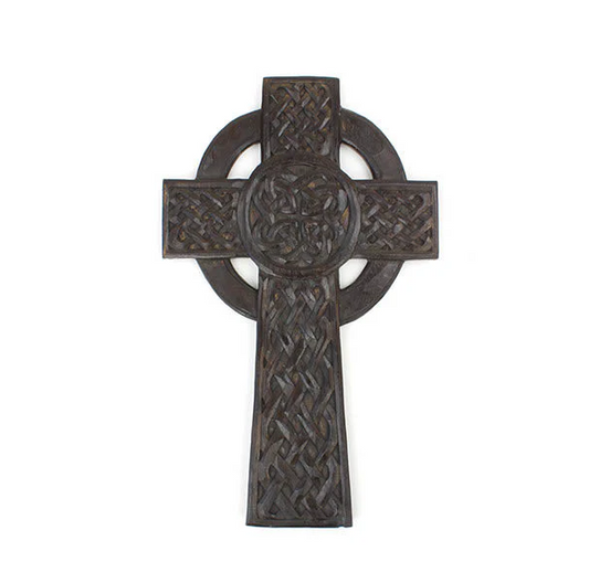 This striking cross has been hand carved in the style of a Celtic cross and features intricate interlace detailing.

A popular legend in Ireland suggests that this sort of cross was created by Saint Patrick whilst he was converting the pagan Irish to Christianity. The theory is that Saint Patrick created the cross to combine Christianity with the ancient sun cross, giving his pagan constituents a link between their religion and the new Christian movement.

These Celtic crosses are hand made by skilled artis