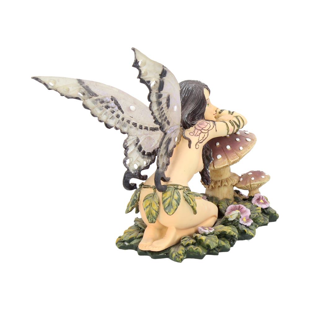 Garden fairy figurine with wings and flowers on a white background