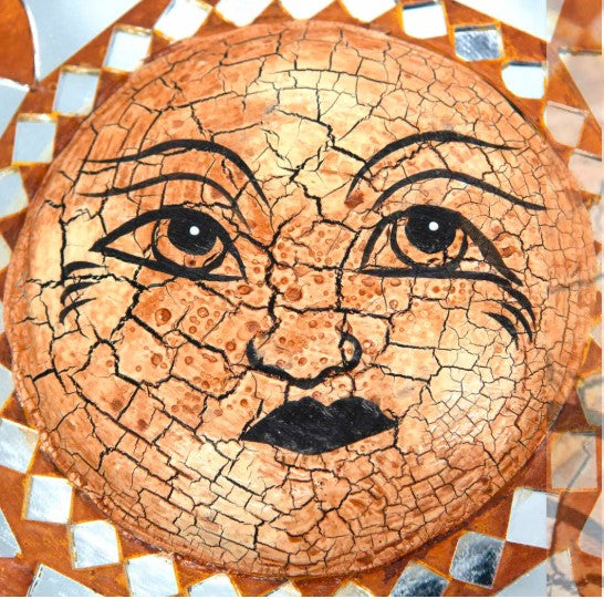 Add a little sunshine with this gorgeous mosaic style mirror with sun design. Painted in rich earthy tones, this piece of wall art features a rustic, distressed face with delicately cut mirrored pieces. Ideal to bright up any room in your home.
