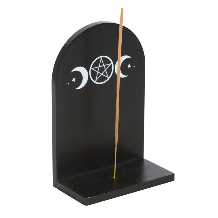 Bring celestial energy and practical style to your space with the Black Triple Moon Incense Holder Shelf. Crafted from black wood and adorned with a carved triple moon design, this mystical shelf is perfect for holding incense sticks, allowing fragrance to disperse freely throughout your home.

When not in use for incense, it doubles as a display shelf for crystals, trinkets, or other small treasures. A pre-installed bracket on the reverse ensures effortless wall mounting, making it an ideal addition to alt