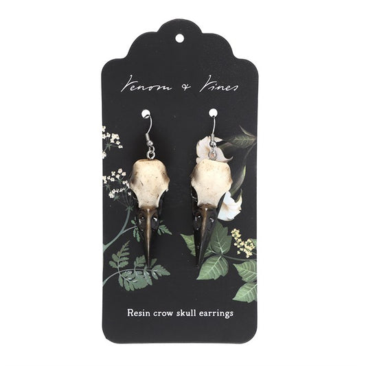 Complete your look with these statement resin crow skull dangle earrings. Light yet durable, they add an edgy and gothic touch to your style.