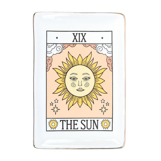 Embrace the radiant energy of The Sun with this vintage tarot-inspired trinket dish, designed to hold your jewellery, keys, and cherished small treasures. Its intricate design, highlighted by shimmering gold edging, brings a magical glow to any desk, vanity, or side table. Crafted by Something Different Wholesale, this piece is part of the Vintage Tarot collection, perfect for those who seek to infuse their space with mystical charm and timeless symbolism. Let this enchanting dish be a daily reminder of cla